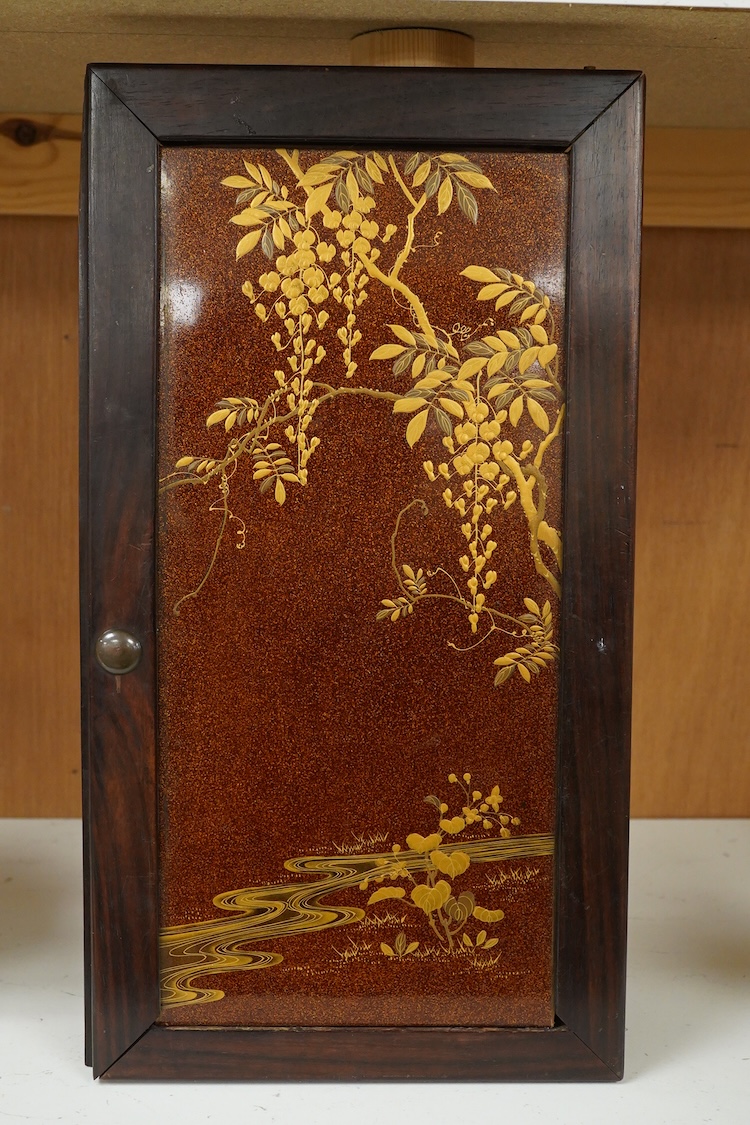 A Japanese gold lacquer panel inlaid with a bone stork and flowers (some losses), framed, 34cm high